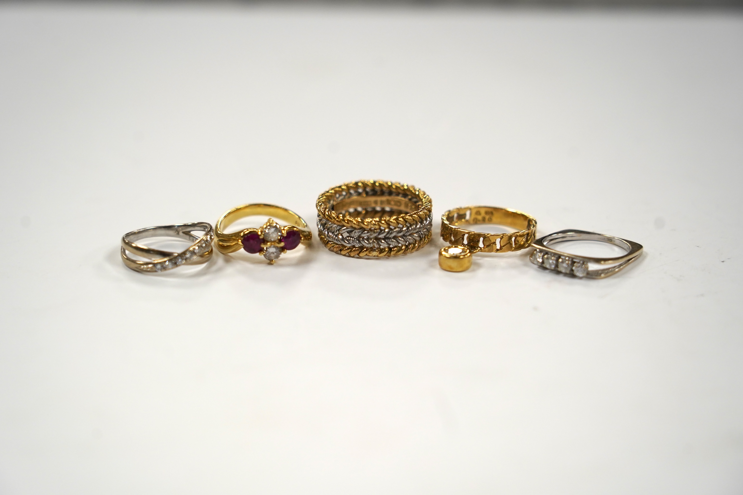 A modern Chou Chou 18k and Pm four band rope twist ring, size Q, A french white metal (18ct mark) and four stone diamond ring, an 18k two stone ruby and two stone diamond set ring, an 18k white metal and diamond chip set